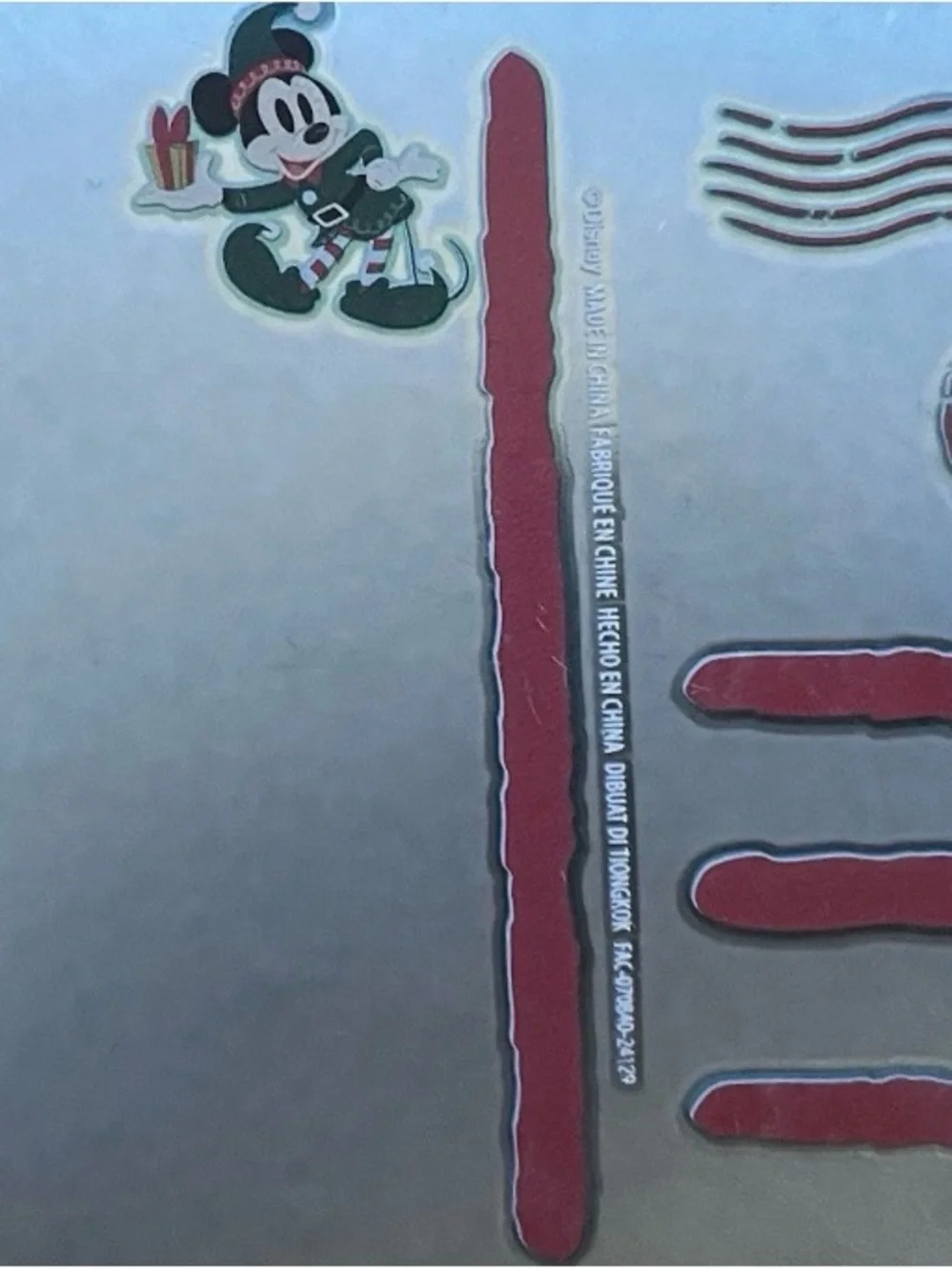 Disney Silver Holiday Ornament with Red and Green Accents